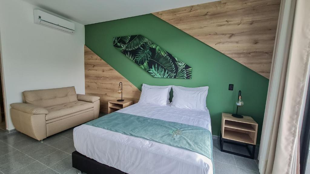 Postel nebo postele na pokoji v ubytování Hotel Arbóreo Doradal