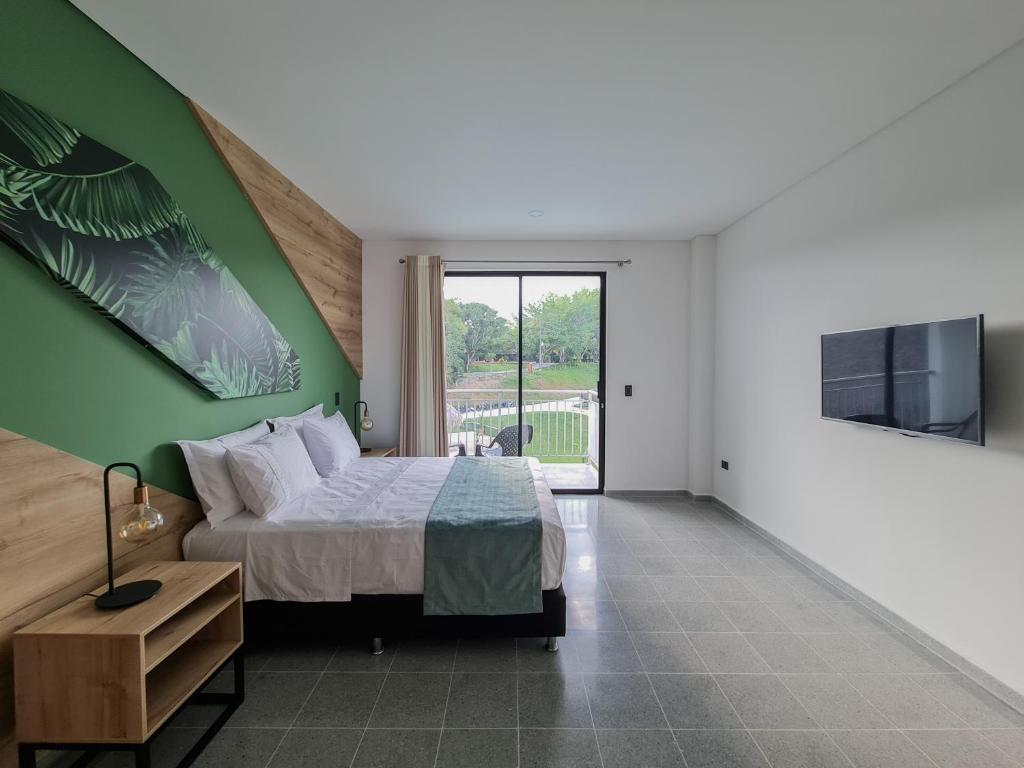 Postel nebo postele na pokoji v ubytování Hotel Arbóreo Doradal