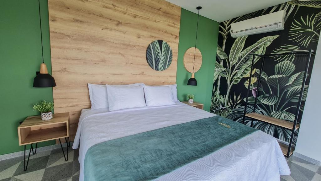 Postel nebo postele na pokoji v ubytování Hotel Arbóreo Doradal