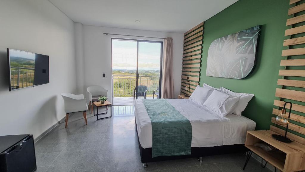 Postel nebo postele na pokoji v ubytování Hotel Arbóreo Doradal