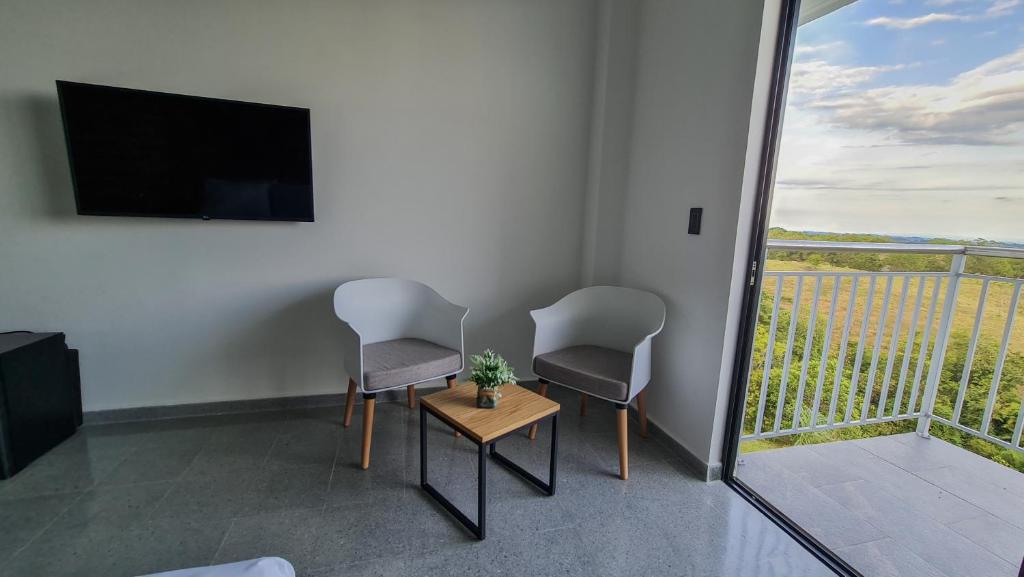 TV a/nebo společenská místnost v ubytování Hotel Arbóreo Doradal