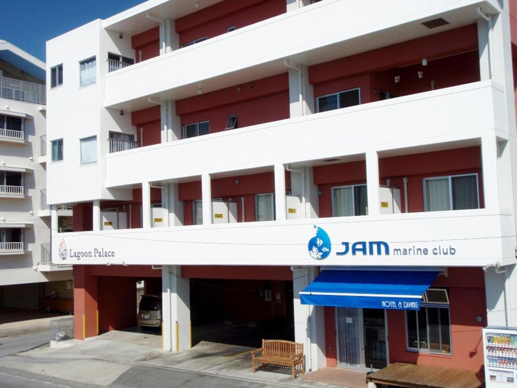 a building with a sign for the jann market club at Lagoon Palace - Vacation STAY 95305v in Nogunukaniku