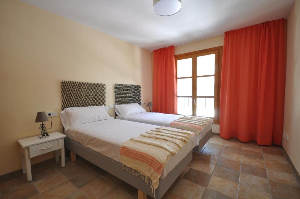 Postel nebo postele na pokoji v ubytování Houm Villa Cala Pi