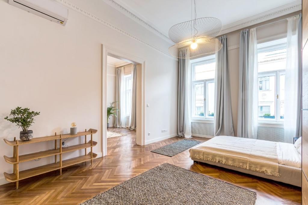 Posteľ alebo postele v izbe v ubytovaní Central Basilica Apartman