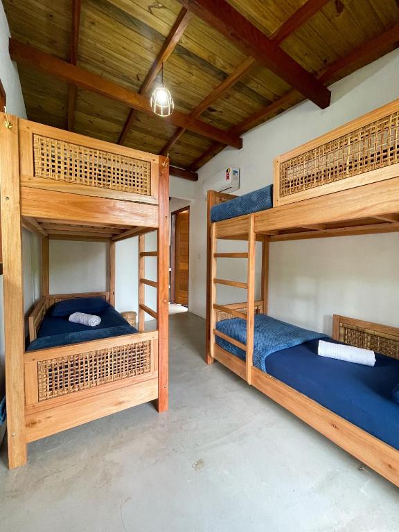Postel nebo postele na pokoji v ubytování Vulva Caraíva Hostel e Pousada para Mulheres