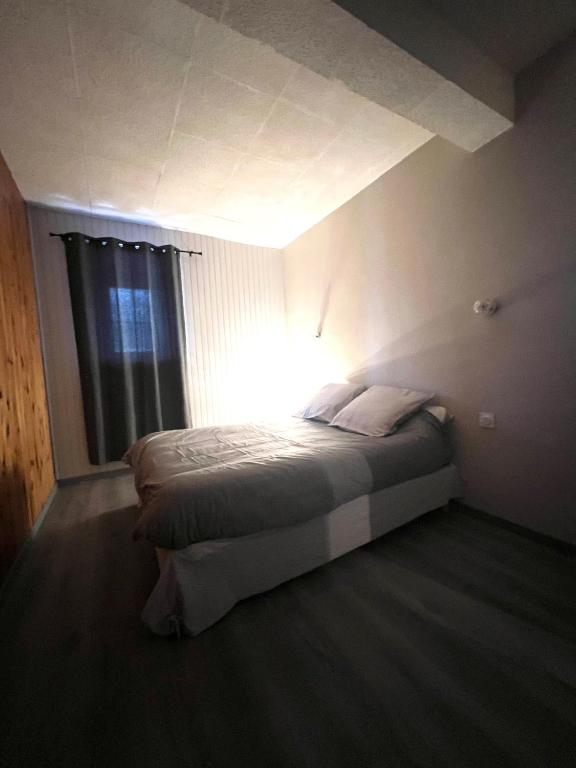 Postel nebo postele na pokoji v ubytování Le cocon des Nestes