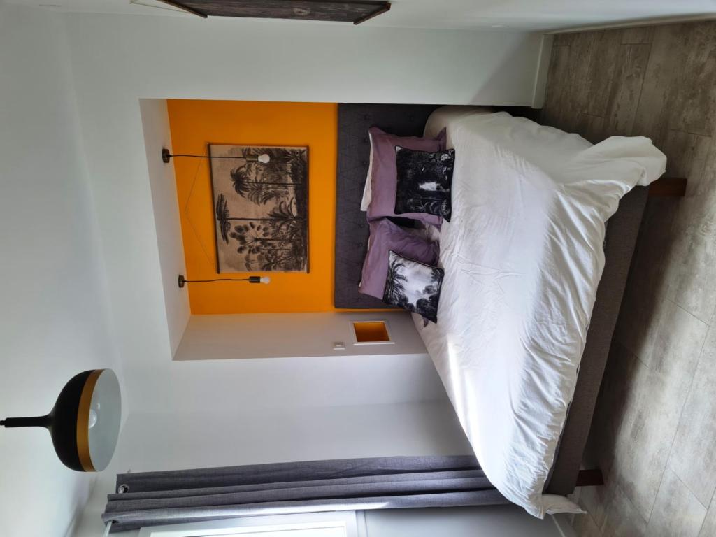 Postel nebo postele na pokoji v ubytování La Maison