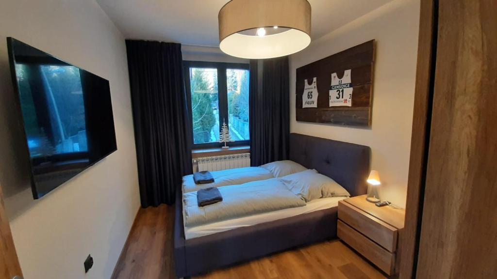 Posteľ alebo postele v izbe v ubytovaní Dom Minimal House