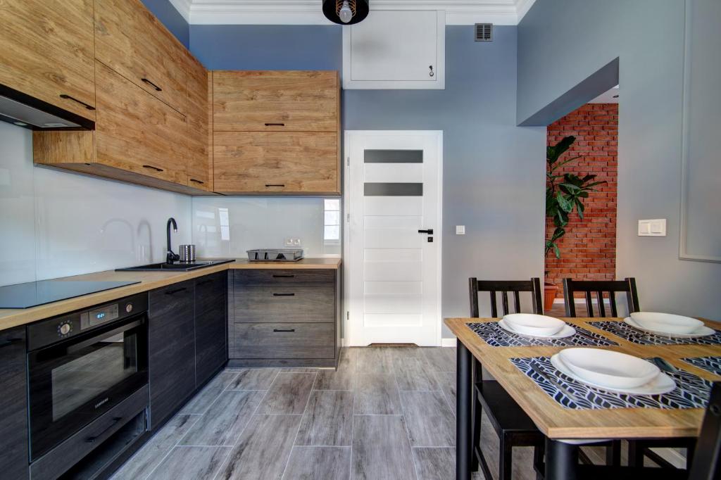 Kuchyňa alebo kuchynka v ubytovaní Rentimi - Apartament Kościuszki