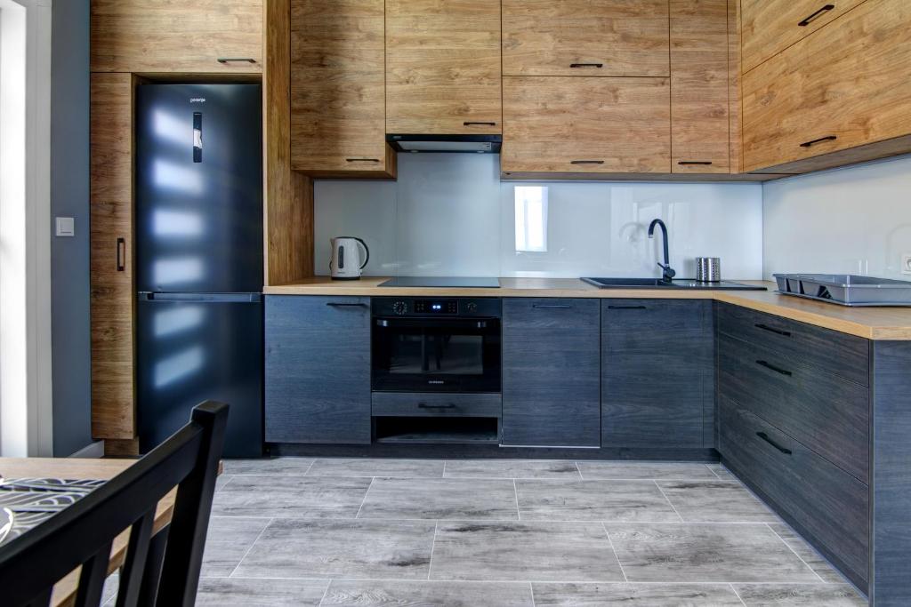 Kuchyňa alebo kuchynka v ubytovaní Rentimi - Apartament Kościuszki
