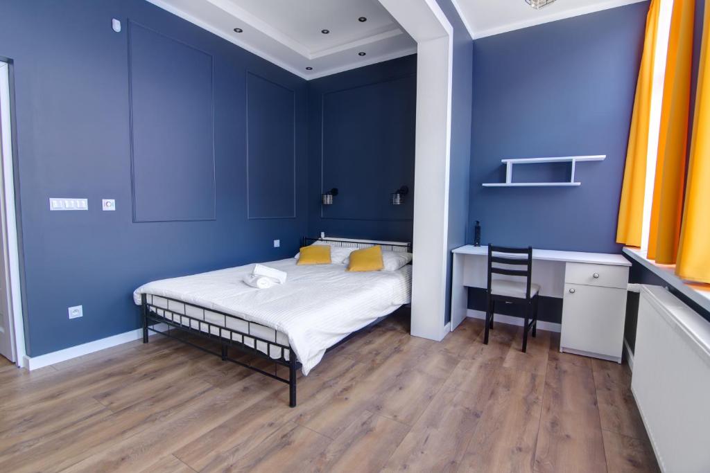 Posteľ alebo postele v izbe v ubytovaní Rentimi - Apartament Kościuszki