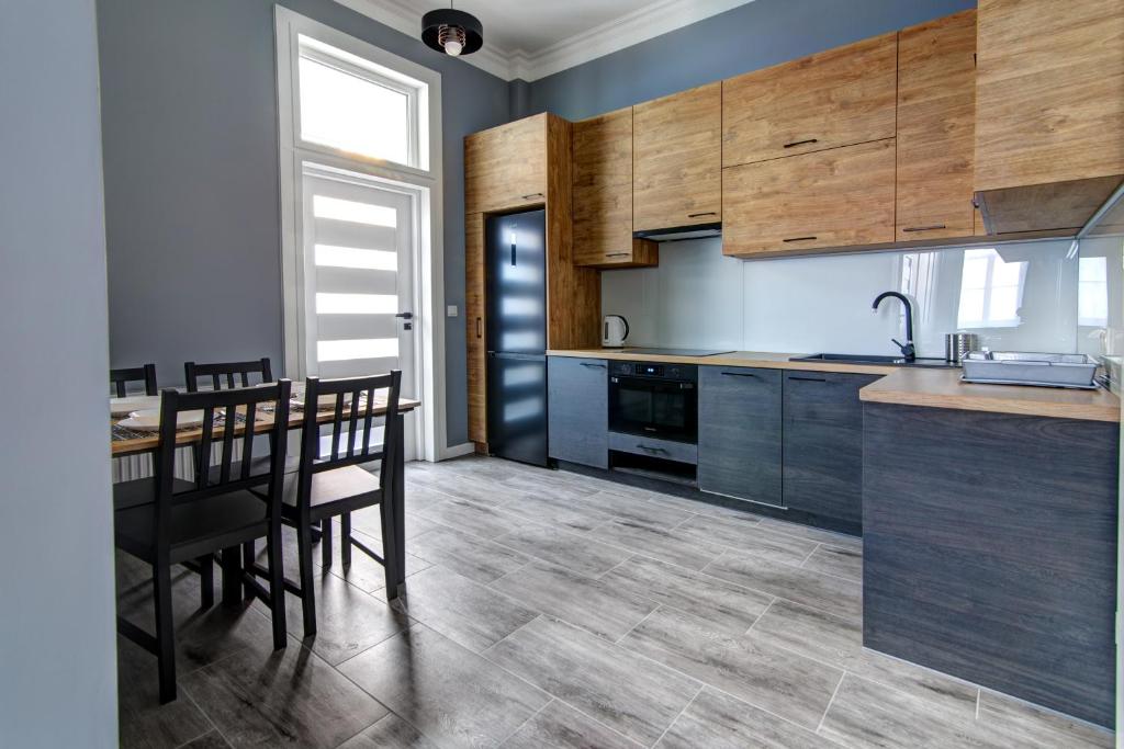 Kuchyňa alebo kuchynka v ubytovaní Rentimi - Apartament Kościuszki