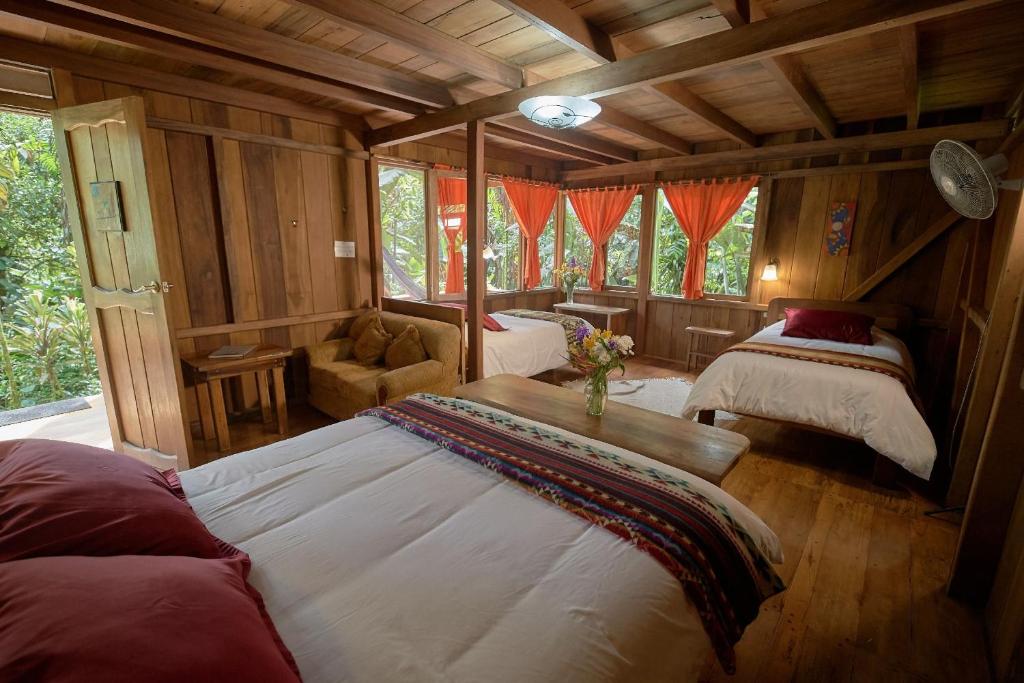 Postel nebo postele na pokoji v ubytování Casa Divina Eco Lodge