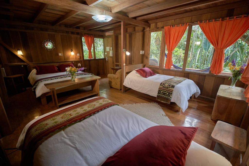 Postel nebo postele na pokoji v ubytování Casa Divina Eco Lodge