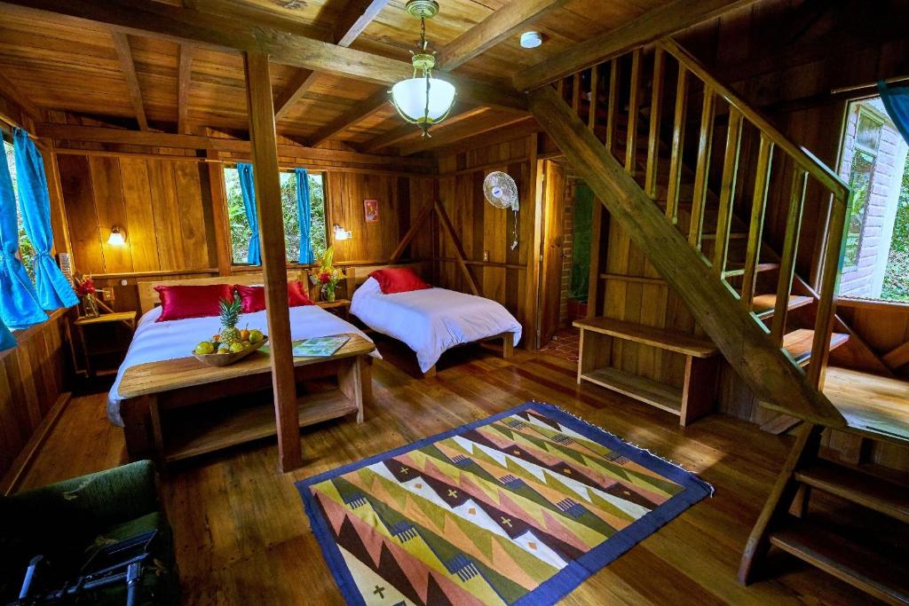 Postel nebo postele na pokoji v ubytování Casa Divina Eco Lodge
