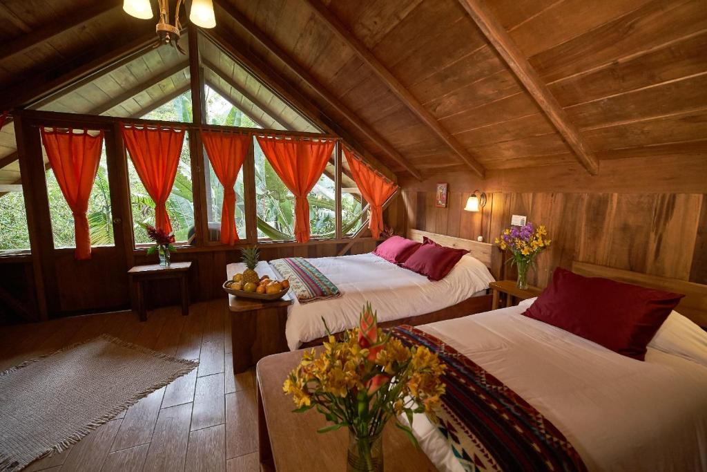 Postel nebo postele na pokoji v ubytování Casa Divina Eco Lodge