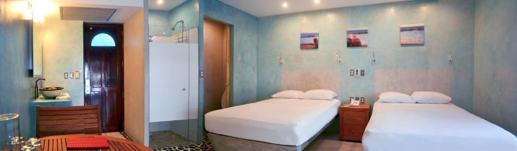 Postel nebo postele na pokoji v ubytování Hotel Rio Malecon