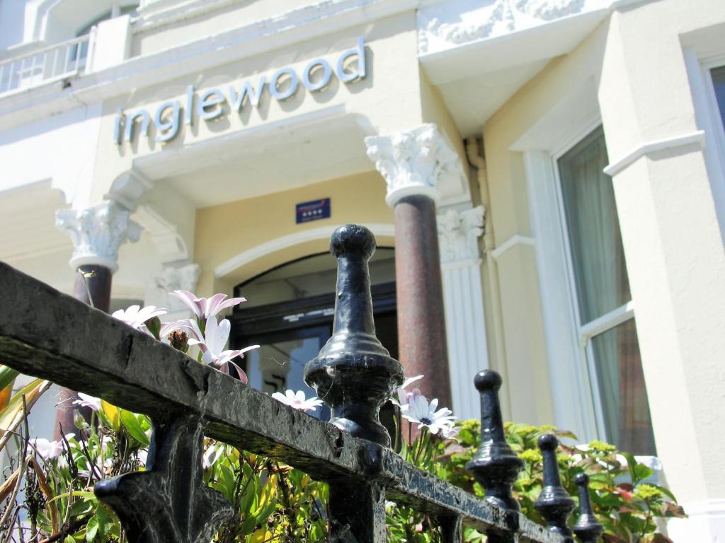 a building with a fence in front of it at Inglewood in Douglas