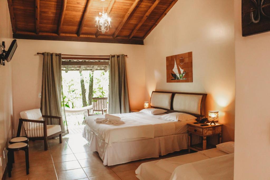Cama ou camas em um quarto em Pousada Villa Bella