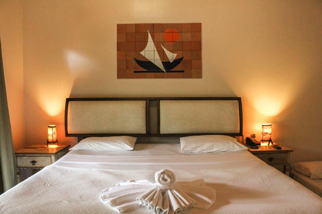 Cama ou camas em um quarto em Pousada Villa Bella