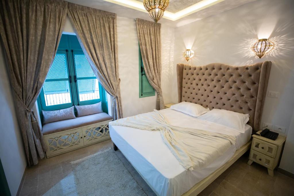 Postel nebo postele na pokoji v ubytování Dar Hammamet Guest House & Hammam