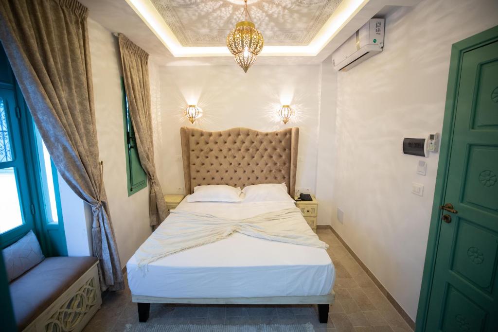 Postel nebo postele na pokoji v ubytování Dar Hammamet Guest House & Hammam