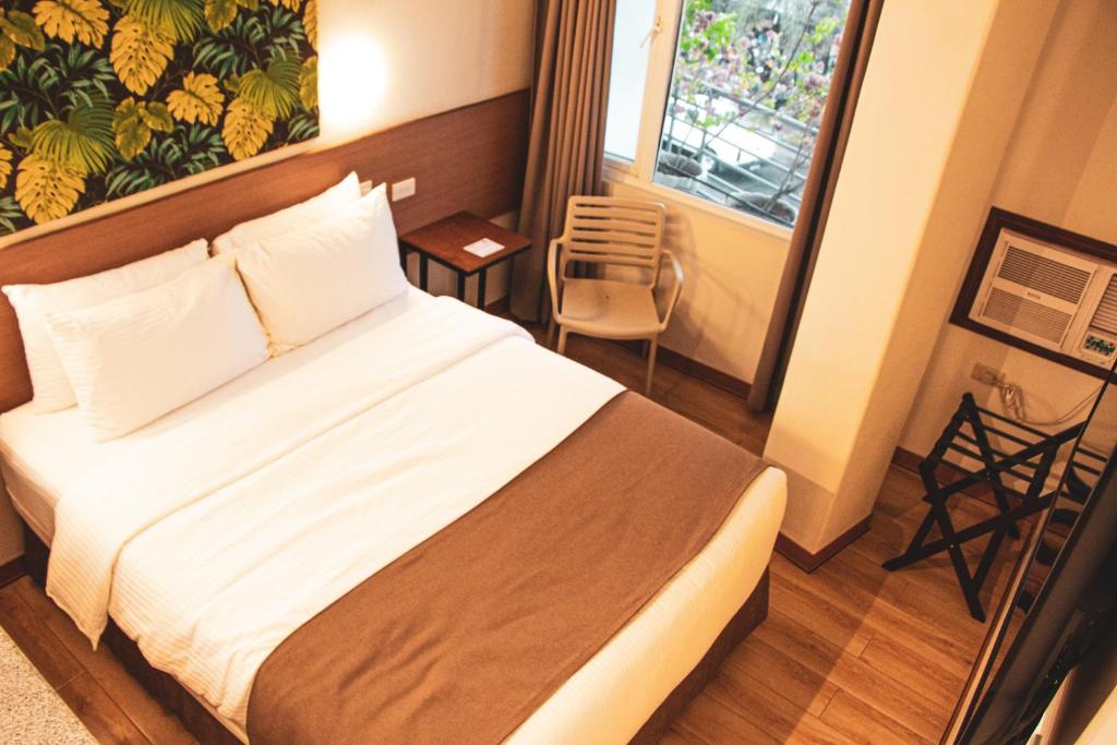 Postel nebo postele na pokoji v ubytování Hotel Sentro Legazpi