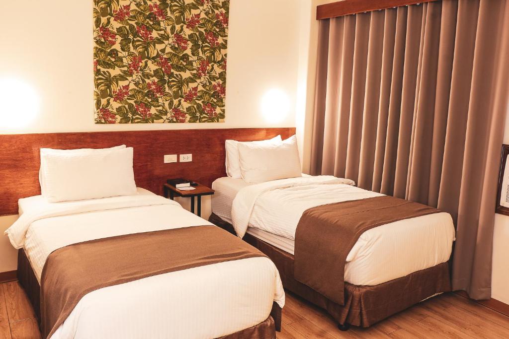 Postel nebo postele na pokoji v ubytování Hotel Sentro Legazpi