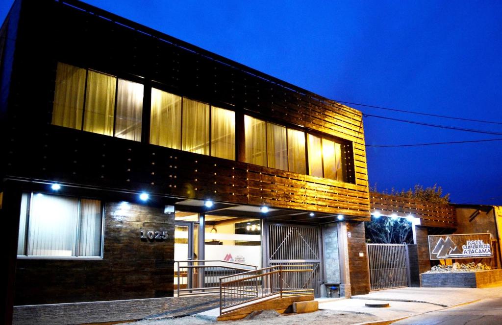 a brick building with a staircase in front of it at Hotel Cumbres de Atacama in Copiapó