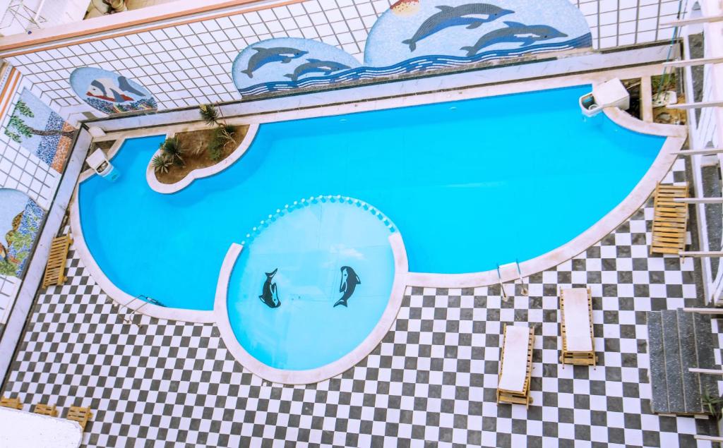 a swimming pool with a face in the water at Rare New Marina Hotspot With Pool & Fast Free WIFI - Western Standards - Sheraton Plaza 415 in Hurghada