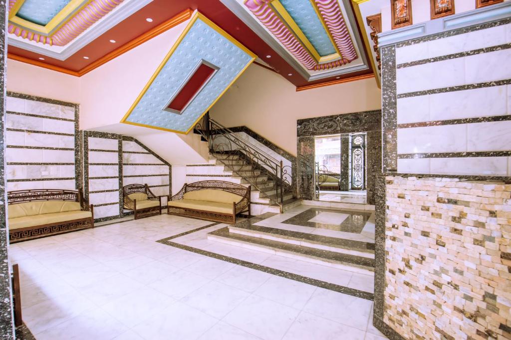 an empty room with stairs and a ceiling at Rare New Marina Hotspot With Pool & Fast Free WIFI - Western Standards - Sheraton Plaza 415 in Hurghada