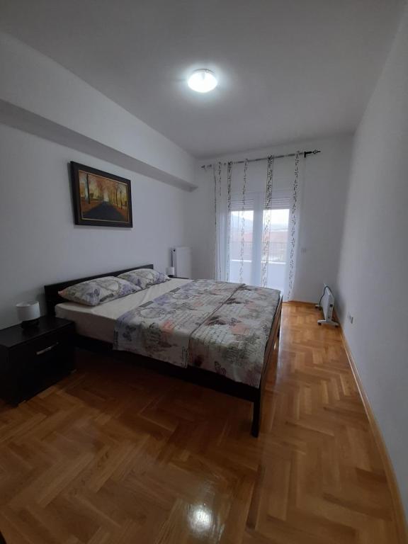 Postel nebo postele na pokoji v ubytování Apartman Green wood