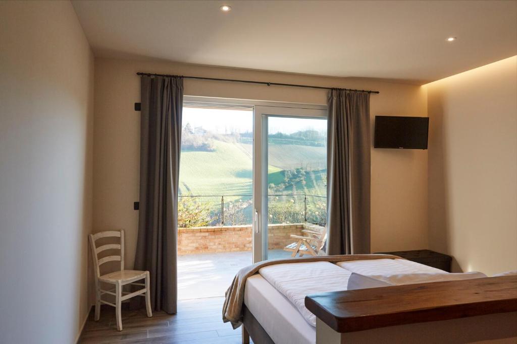Posteľ alebo postele v izbe v ubytovaní Agriturismo Alba Del Borgo