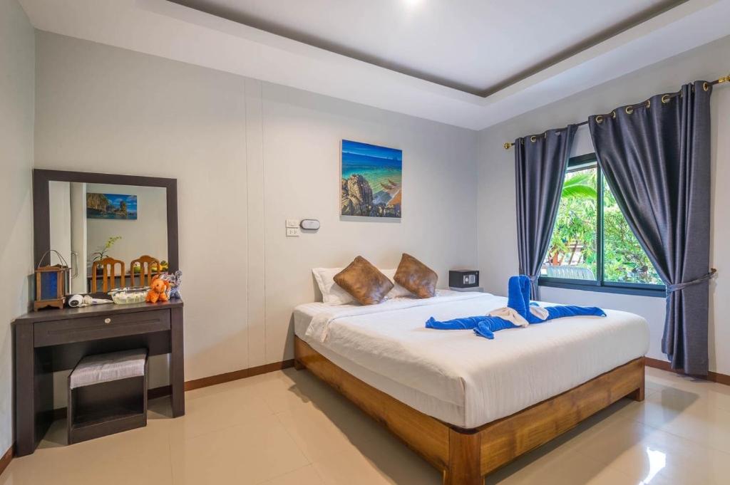En eller flere senge i et værelse på Klongdao Sunset Villa