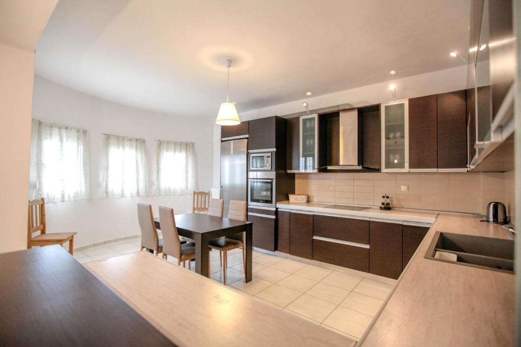 A kitchen or kitchenette at Meteora's Secret Garden House#2