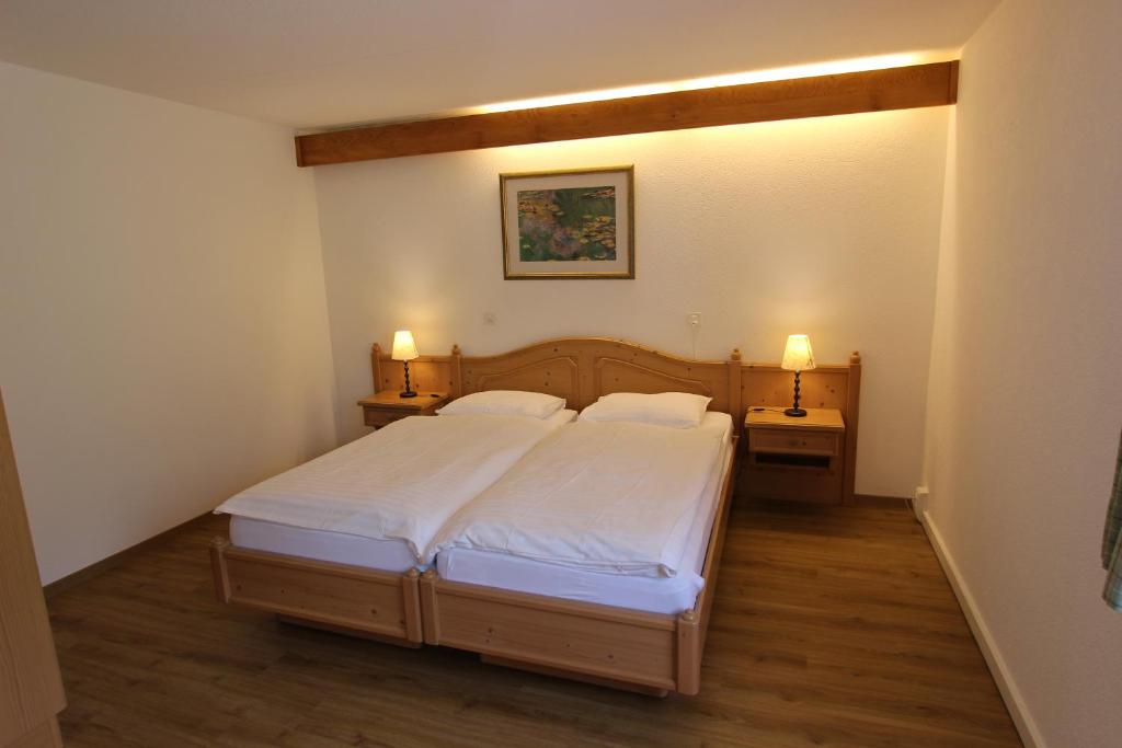Postel nebo postele na pokoji v ubytování Hotel Roc et Neige
