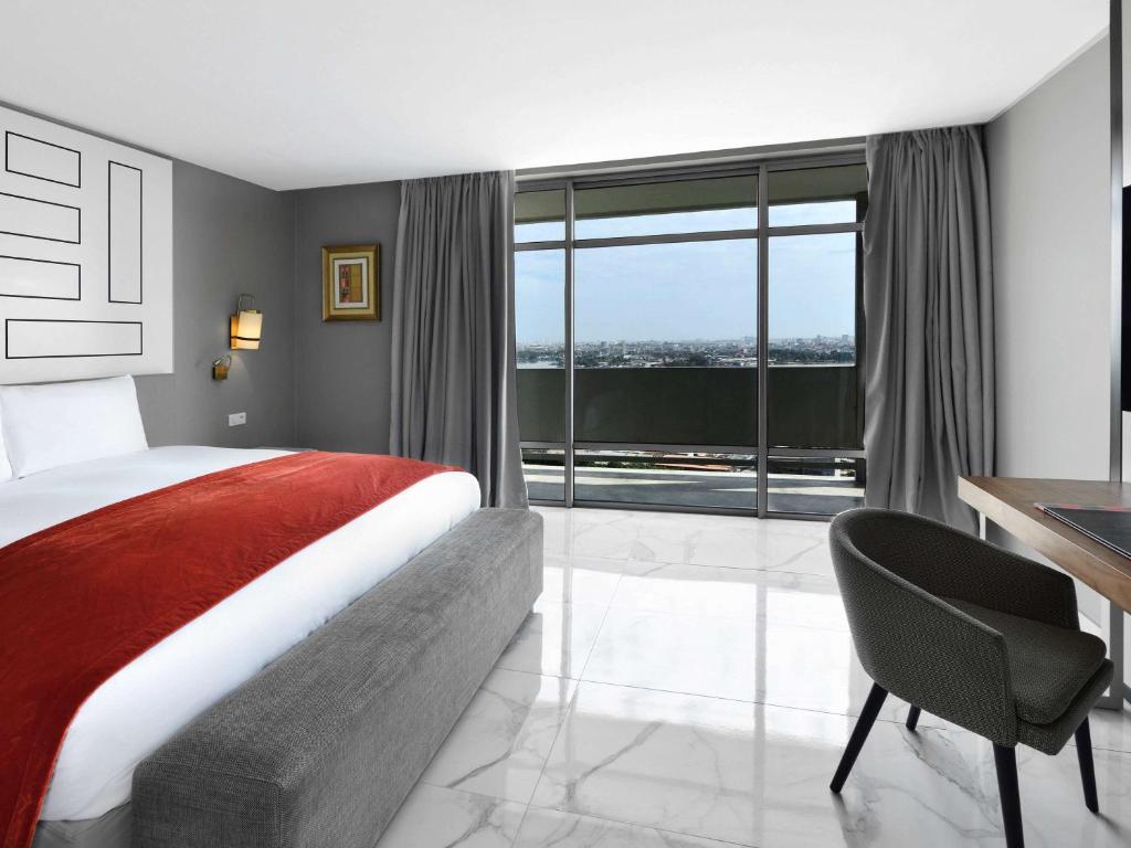 Un ou plusieurs lits dans un hébergement de l'établissement Sofitel Abidjan Hotel Ivoire