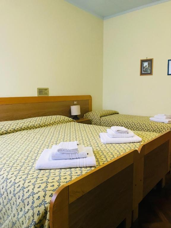 Postel nebo postele na pokoji v ubytování Hotel La Torretta