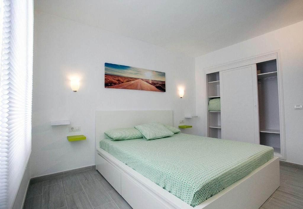 Postel nebo postele na pokoji v ubytování Vivienda Vacacional Erido