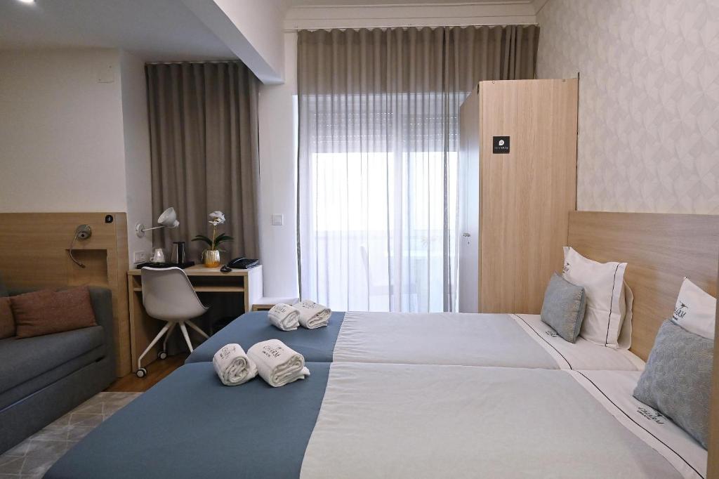 Postel nebo postele na pokoji v ubytování My Charm Lisbon Suites