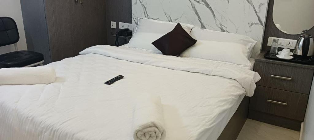 Postel nebo postele na pokoji v ubytování Sanns Tropicana