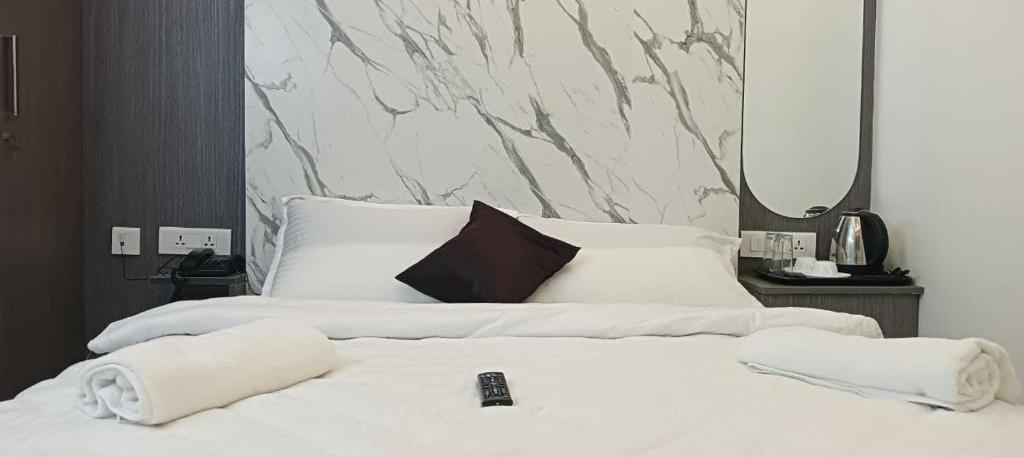 Postel nebo postele na pokoji v ubytování Sanns Tropicana