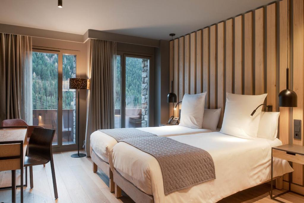 Postel nebo postele na pokoji v ubytování Hotel Naudi Boutique Adults only