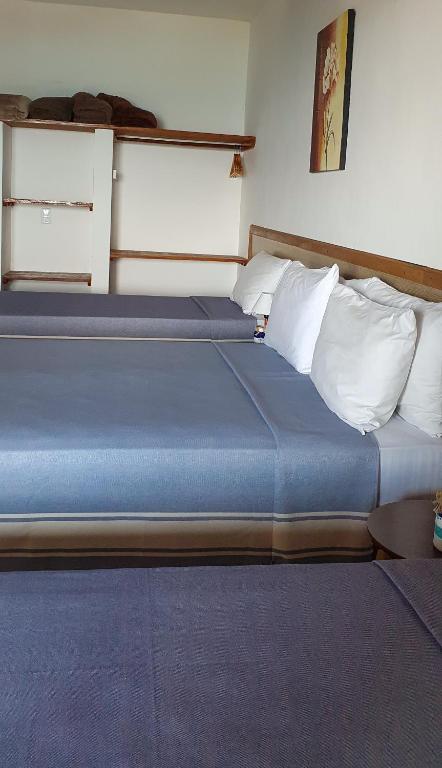 Postel nebo postele na pokoji v ubytování Pousada Três Coqueiros