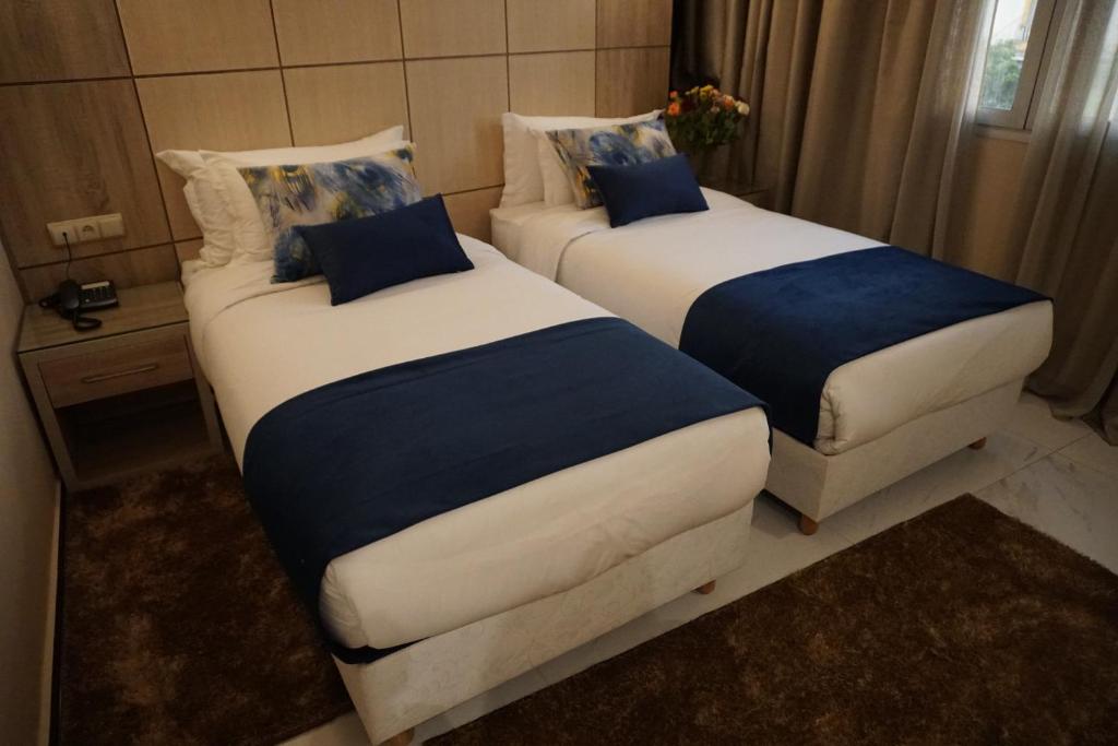 Postel nebo postele na pokoji v ubytování Hôtel Volubilis Meknès