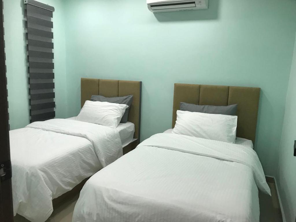 Postel nebo postele na pokoji v ubytování Homestay Stardow~星窗名宿~