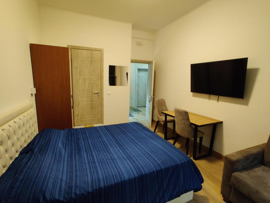 Televízia a/alebo spoločenská miestnosť v ubytovaní B&B Crocevia