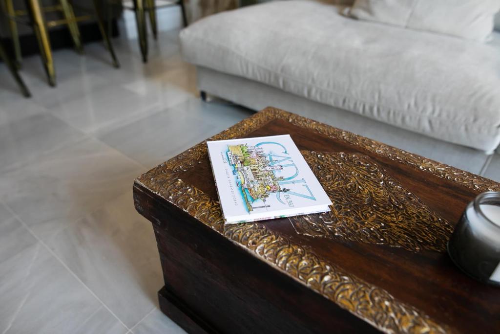 Postel nebo postele na pokoji v ubytování innCádizPalacio Conde Casa-Brunet