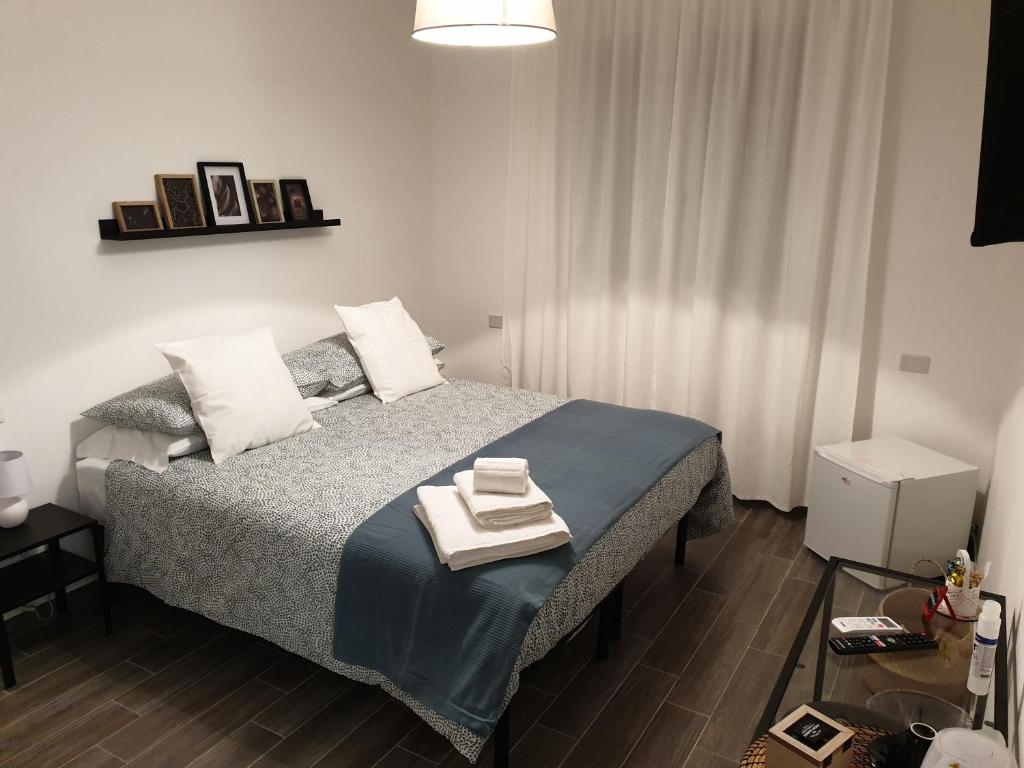 Posteľ alebo postele v izbe v ubytovaní Residenza Tarzanà