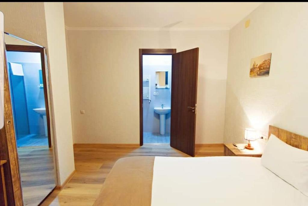 Postel nebo postele na pokoji v ubytování Hotel Tabi